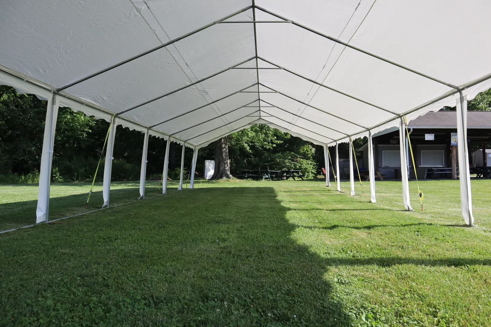 Inside a white event tent set up on the grounds