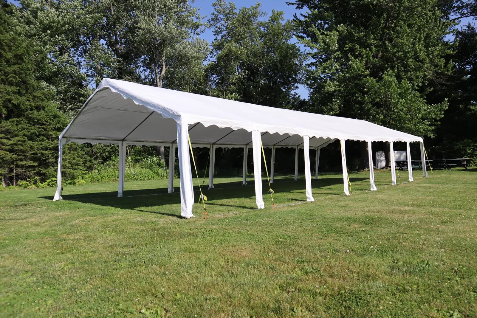 A long white event tent on the grounds