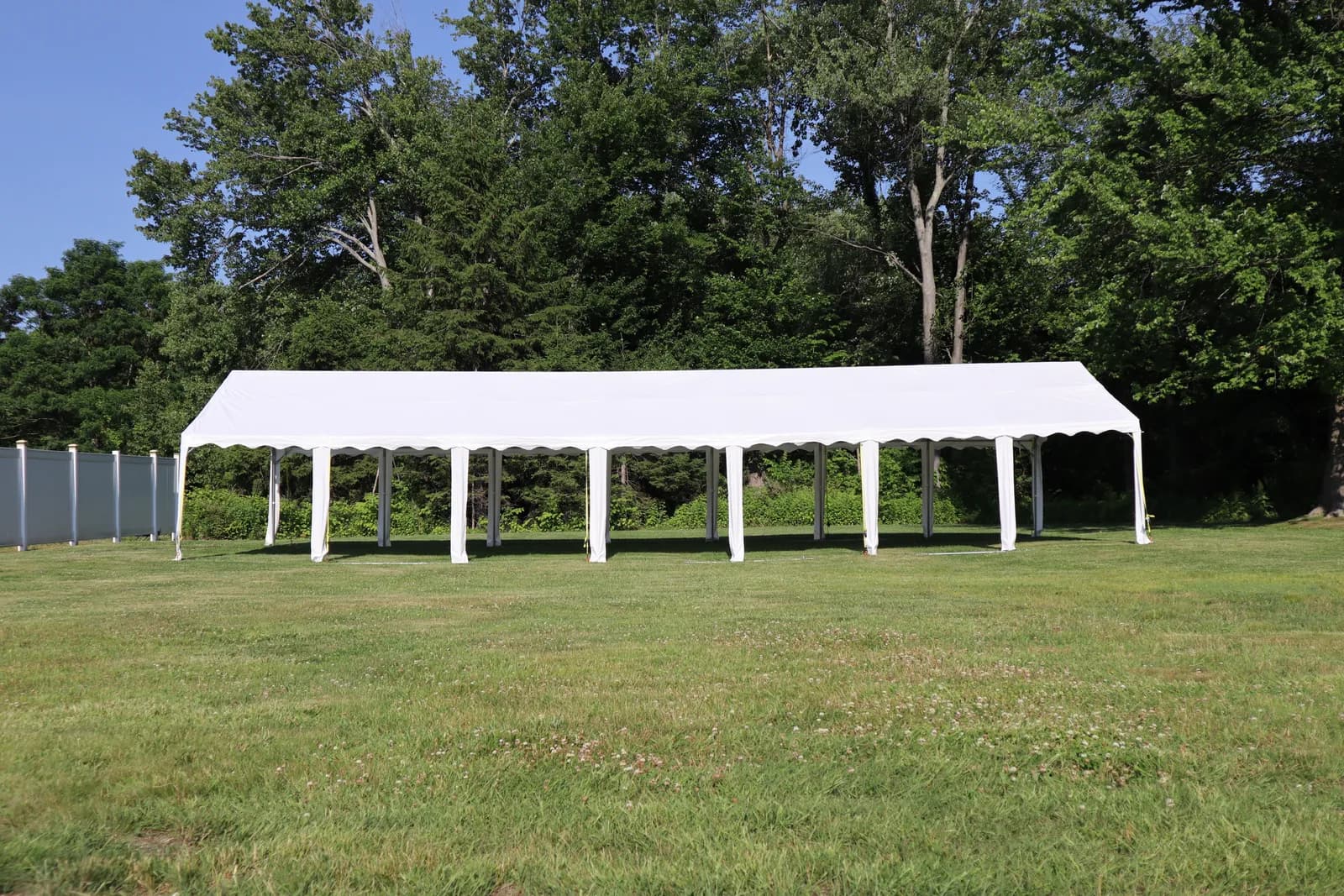 Side view of an event tent on the club grounds