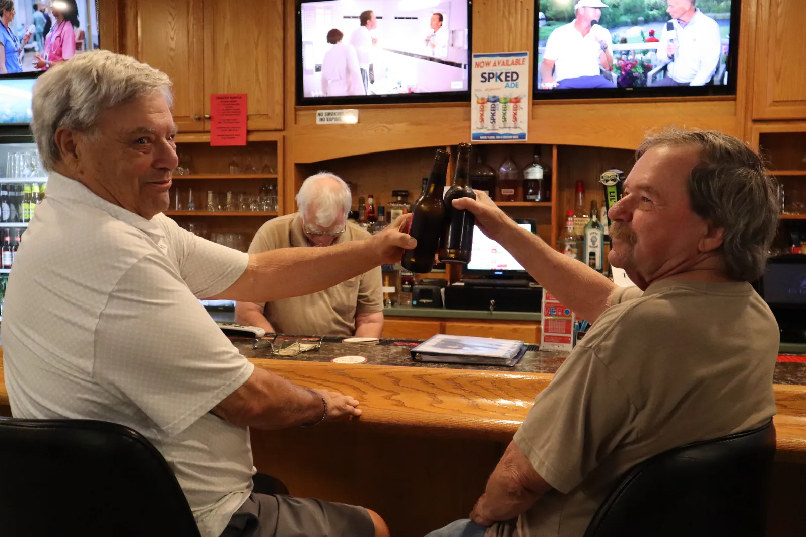 Members socializing at the bar inside the clubhouse