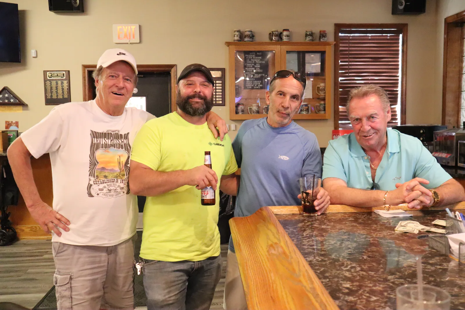 Members raising a toast together at the club bar