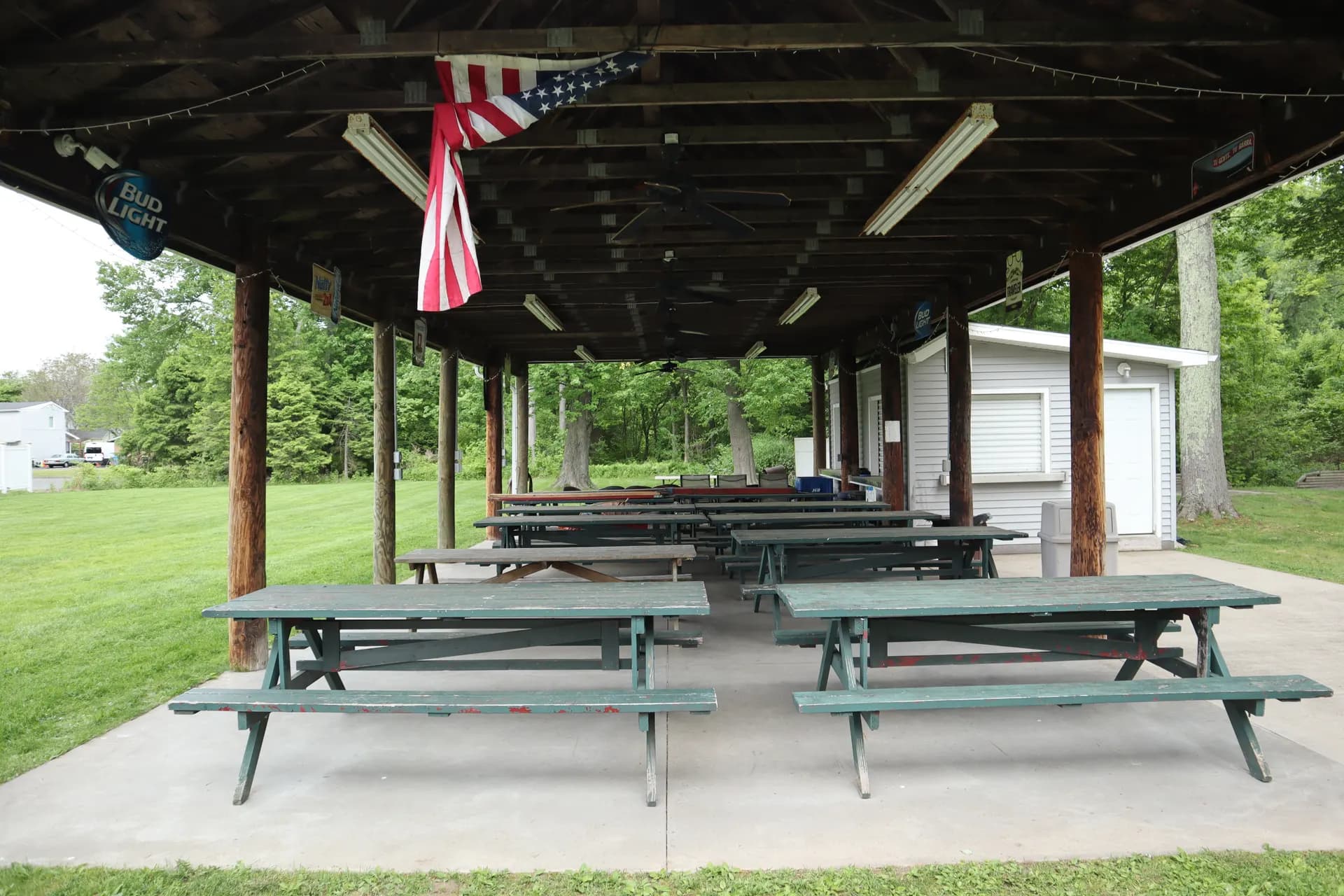 Rows of picnic tables under the covered outdoor pavilion